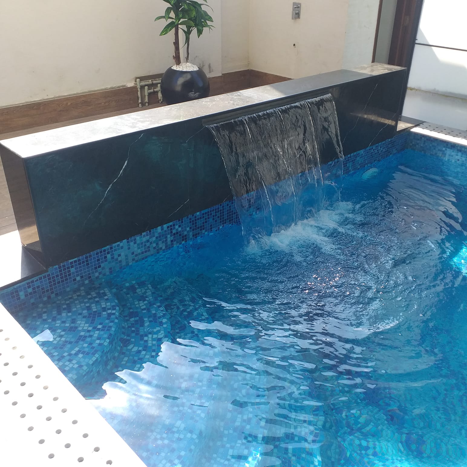 Pool deck detail with mosaic tiling